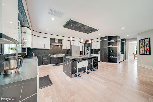 9908 Blake Ln, Oakton, VA 22124 - kitchen featuring open shelves, freestanding refrigerator, wall chimney exhaust hood, backsplash, and recessed lighting