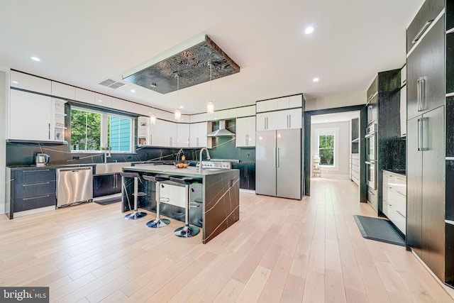 9908 Blake Ln, Oakton, VA 22124 - kitchen featuring stainless steel appliances, open shelves, plenty of natural light, backsplash, and recessed lighting