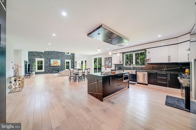 9908 Blake Ln, Oakton, VA 22124 - kitchen featuring dishwasher, modern cabinets, white cabinets, open floor plan, and recessed lighting