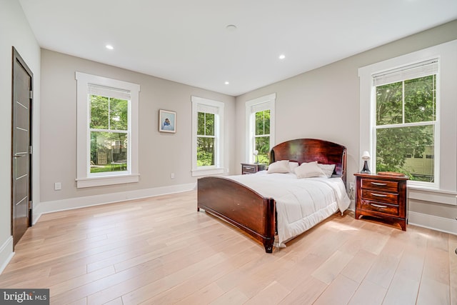 9908 Blake Ln, Oakton, VA 22124 - bedroom featuring multiple windows, light wood-type flooring, and recessed lighting