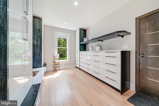 9908 Blake Ln, Oakton, VA 22124 - unfurnished bedroom with light wood-type flooring, recessed lighting, and high end fridge