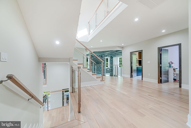 9908 Blake Ln, Oakton, VA 22124 - staircase featuring wood finished floors and recessed lighting