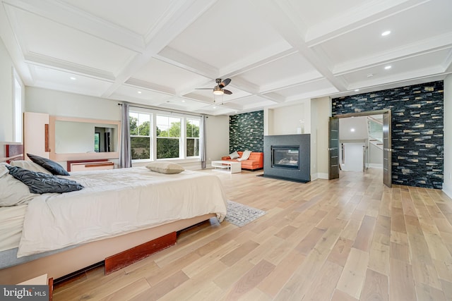 9908 Blake Ln, Oakton, VA 22124 - bedroom with light wood-type flooring, a multi sided fireplace, coffered ceiling, beamed ceiling, and a ceiling fan