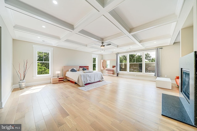 9908 Blake Ln, Oakton, VA 22124 - bedroom featuring a fireplace, beam ceiling, light wood finished floors, coffered ceiling, and ceiling fan
