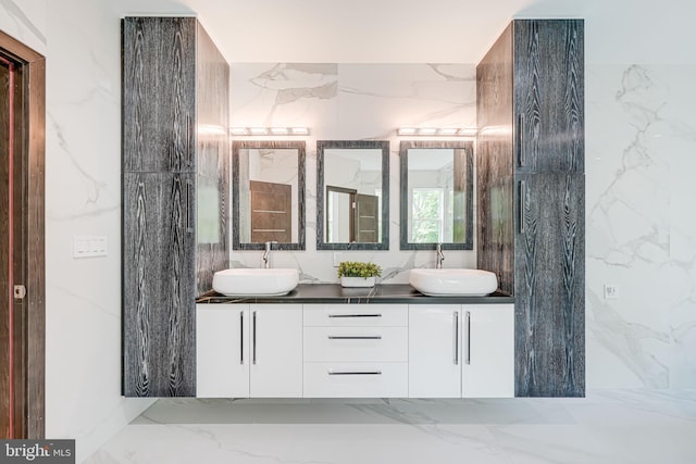 9908 Blake Ln, Oakton, VA 22124 - full bath featuring marble tiled flooring, double vanity, tile walls, and stone wall