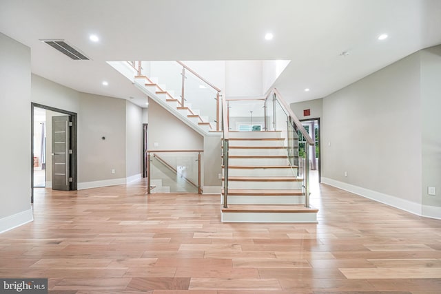 9908 Blake Ln, Oakton, VA 22124 - stairs with wood finished floors and recessed lighting