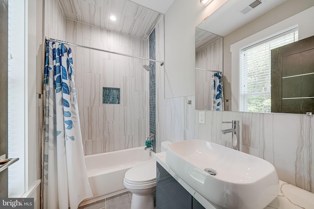 9908 Blake Ln, Oakton, VA 22124 - bathroom with shower / tub combo with curtain, tile walls, vanity, and recessed lighting