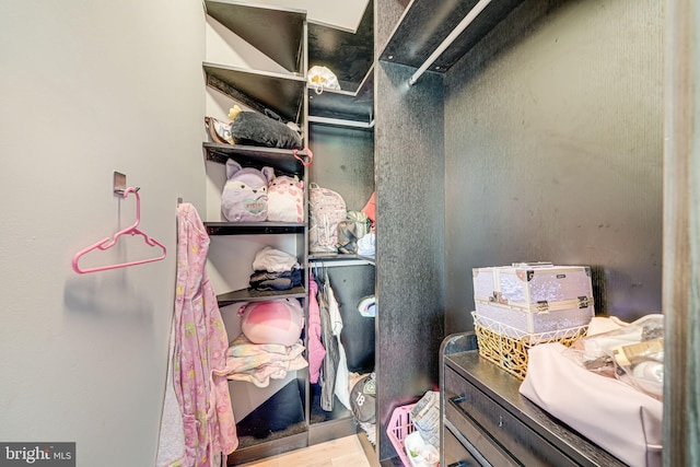 9908 Blake Ln, Oakton, VA 22124 - walk in closet featuring wood finished floors