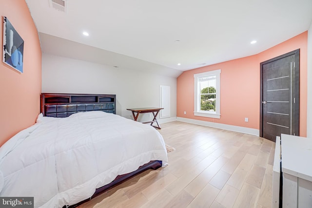 9908 Blake Ln, Oakton, VA 22124 - bedroom featuring wood finished floors, recessed lighting, and lofted ceiling