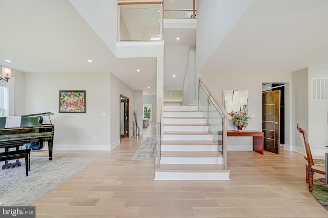 9908 Blake Ln, Oakton, VA 22124 - foyer entrance with stairway, wood finished floors, a towering ceiling, and recessed lighting