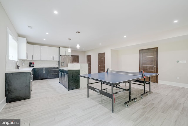 9908 Blake Ln, Oakton, VA 22124 - rec room with light wood-type flooring and recessed lighting