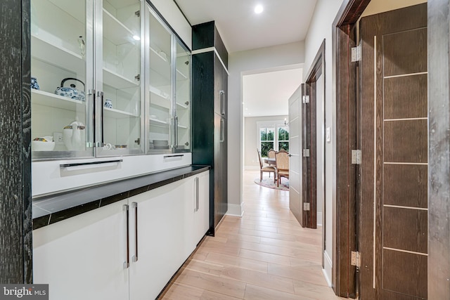 9908 Blake Ln, Oakton, VA 22124 - bar with light wood-type flooring and baseboards