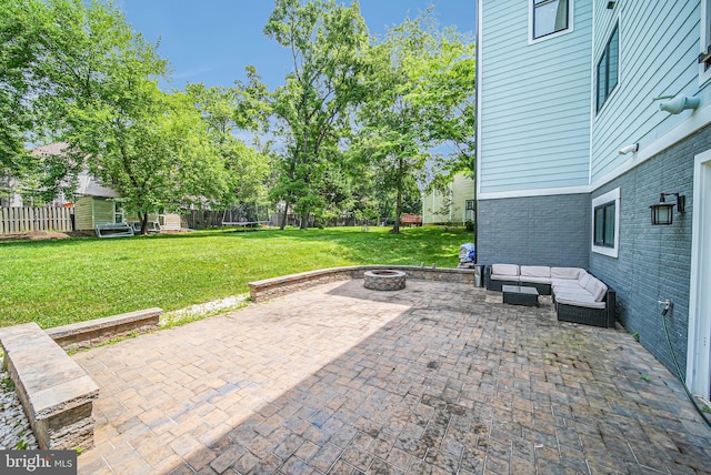 9908 Blake Ln, Oakton, VA 22124 - fenced backyard with an outdoor living space with a fire pit and a patio
