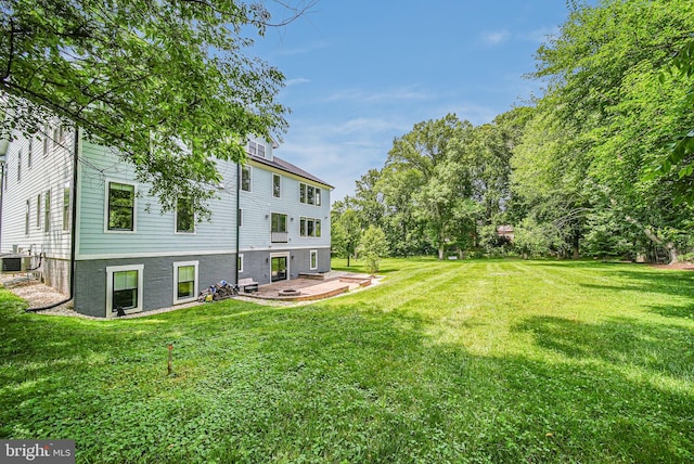 9908 Blake Ln, Oakton, VA 22124 - view of grassy yard featuring a patio