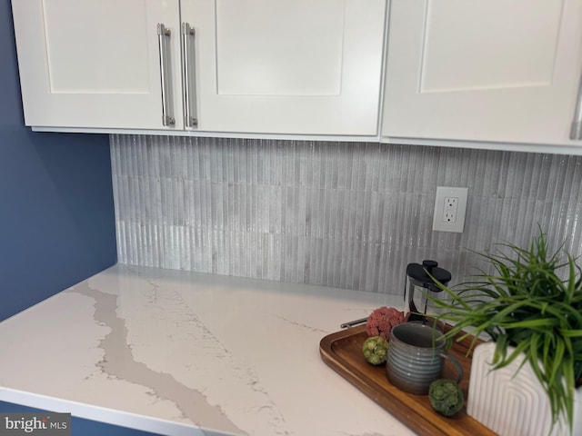 512 Majestic Ave, Bellmawr, NJ 08031 - detailed view of white cabinetry, backsplash, and light stone counters