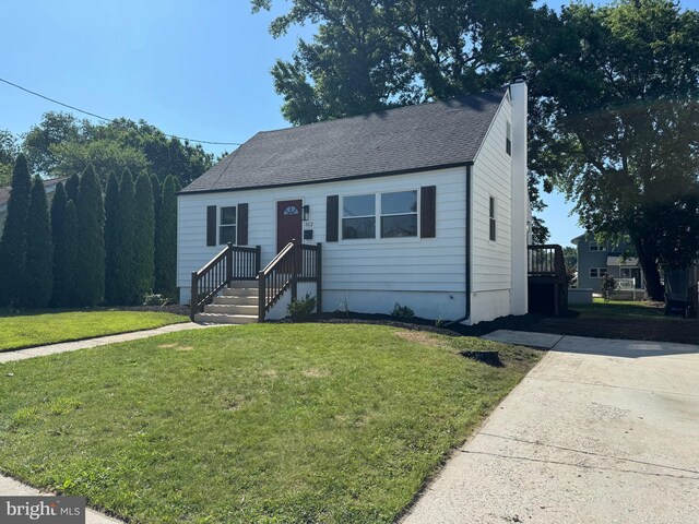 512 Majestic Ave, Bellmawr, NJ 08031 - view of front facade with a front yard and roof with shingles