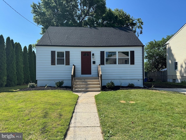 512 Majestic Ave, Bellmawr, NJ 08031 - view of front of house featuring a front lawn and roof with shingles