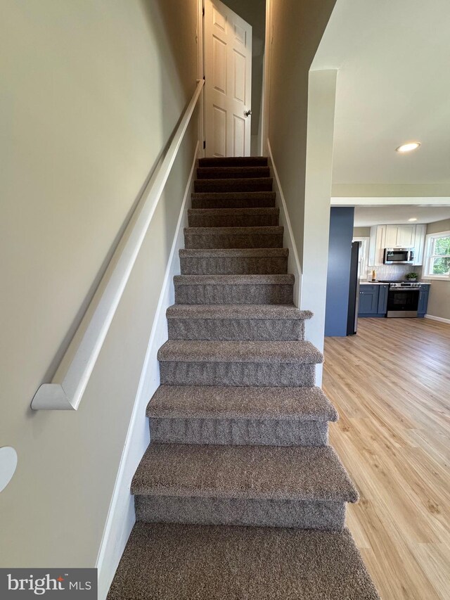 512 Majestic Ave, Bellmawr, NJ 08031 - staircase featuring wood finished floors and recessed lighting