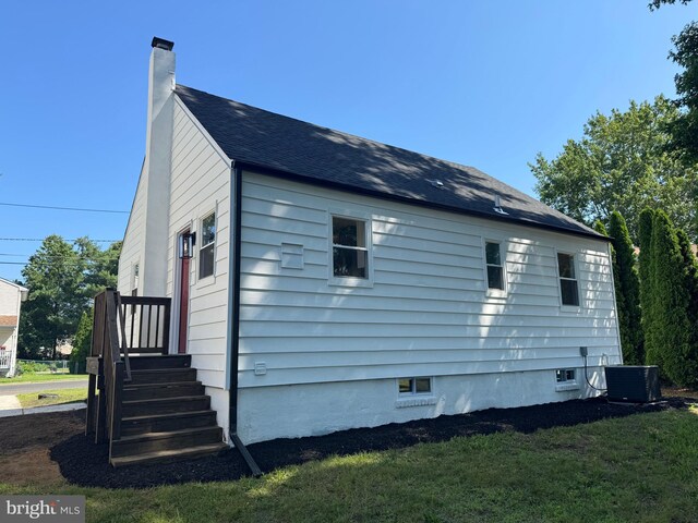512 Majestic Ave, Bellmawr, NJ 08031 - view of side of home with a chimney and a yard