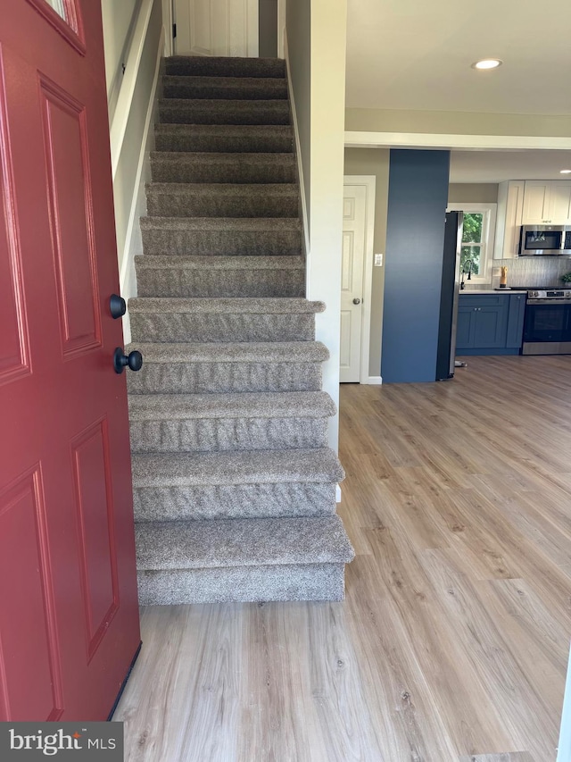 512 Majestic Ave, Bellmawr, NJ 08031 - stairs with wood finished floors and recessed lighting