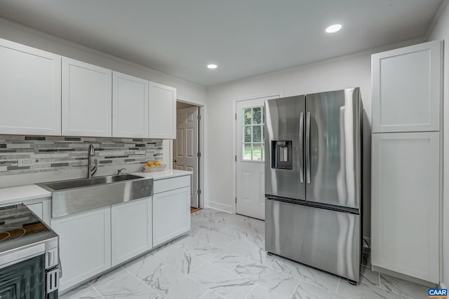 1623 Mason Ln, Charlottesville, VA 22903 - kitchen featuring appliances with stainless steel finishes, recessed lighting, backsplash, white cabinetry, and light marble finish flooring