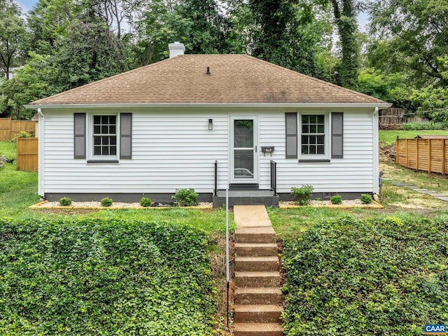 1623 Mason Ln, Charlottesville, VA 22903 - view of front facade featuring a chimney, a shingled roof, and view of scattered trees