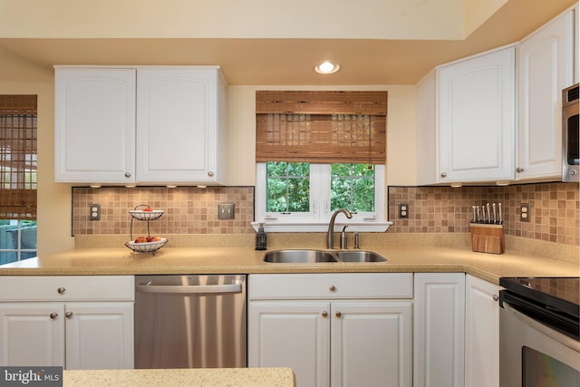 6 Thunder Gulch, Newark, DE 19702 - kitchen featuring stainless steel appliances, white cabinetry, light countertops, recessed lighting, and decorative backsplash
