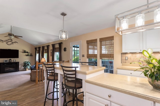 6 Thunder Gulch, Newark, DE 19702 - kitchen with open floor plan, ceiling fan, light countertops, backsplash, and white cabinets