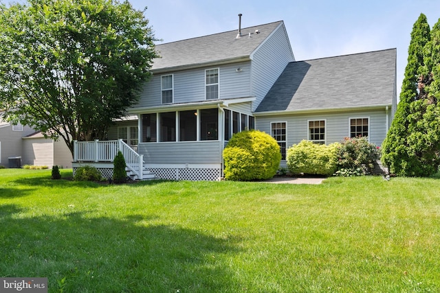 6 Thunder Gulch, Newark, DE 19702 - rear view of property with a sunroom, a lawn, and a shingled roof