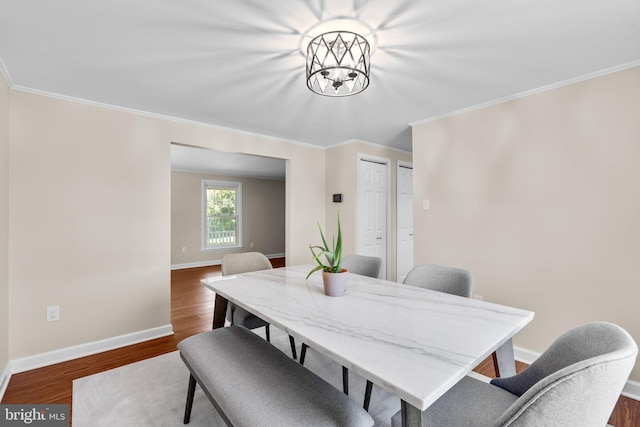 1395 Buckhorn Rd, Sykesville, MD 21784 - dining area with crown molding, dark wood-type flooring, and a chandelier