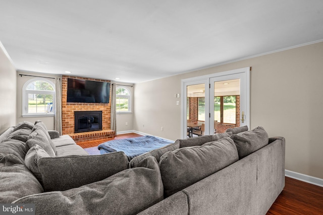 1395 Buckhorn Rd, Sykesville, MD 21784 - living area featuring dark wood-style flooring, a fireplace, and crown molding