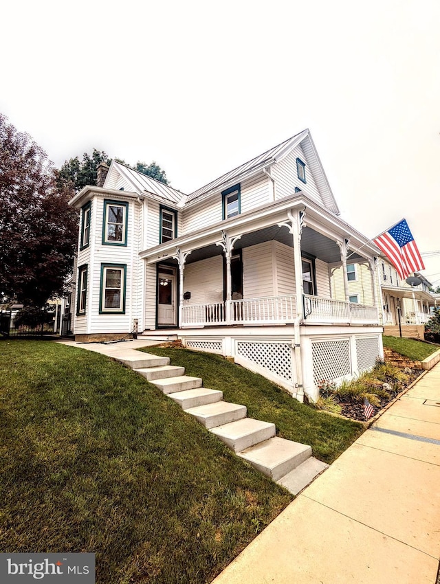113 Gettysburg St, Dillsburg, PA 17019 - view of front of property featuring a porch, a front yard, a standing seam roof, and a metal roof