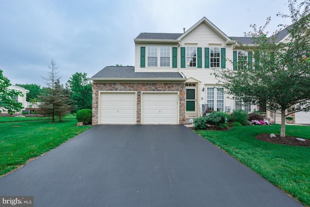 802 Geranium Dr, Warrington, PA 18976 - view of front of home featuring asphalt driveway, stone siding, a front lawn, and a garage