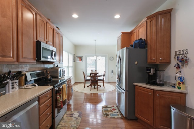 802 Geranium Dr, Warrington, PA 18976 - kitchen featuring stainless steel appliances, dark wood-type flooring, tasteful backsplash, light countertops, and recessed lighting