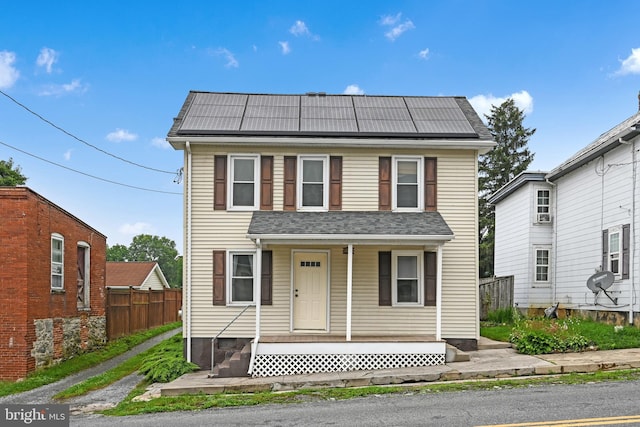 12 Charlestown Rd, Washington Boro, PA 17582 - view of front of home with roof mounted solar panels and covered porch