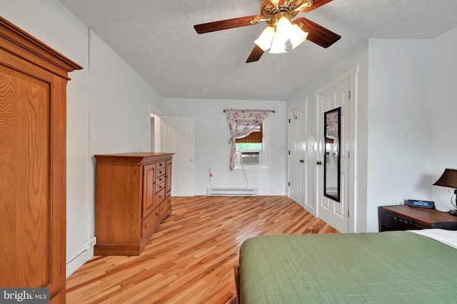 12 Charlestown Rd, Washington Boro, PA 17582 - bedroom featuring light wood-type flooring, a baseboard radiator, cooling unit, and a ceiling fan