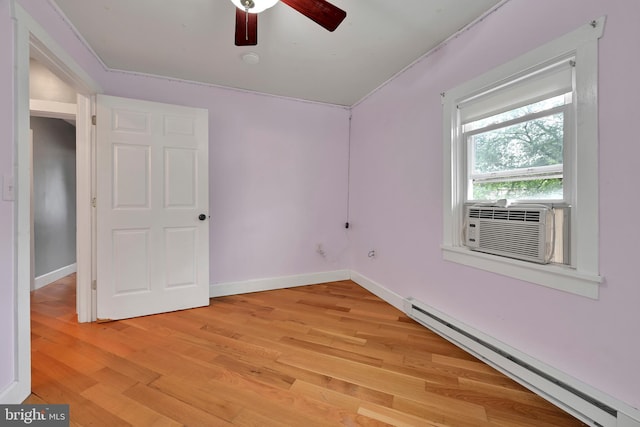 12 Charlestown Rd, Washington Boro, PA 17582 - empty room featuring a baseboard radiator, light wood-type flooring, a ceiling fan, and cooling unit