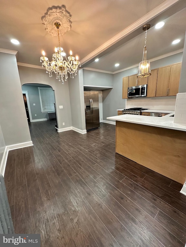 2937 N Judson St, Philadelphia, PA 19132 - kitchen with appliances with stainless steel finishes, arched walkways, light countertops, a chandelier, and crown molding
