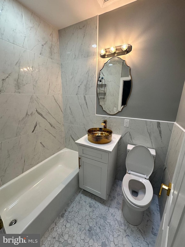 2937 N Judson St, Philadelphia, PA 19132 - full bath with tile walls, vanity, wainscoting, and shower / tub combination