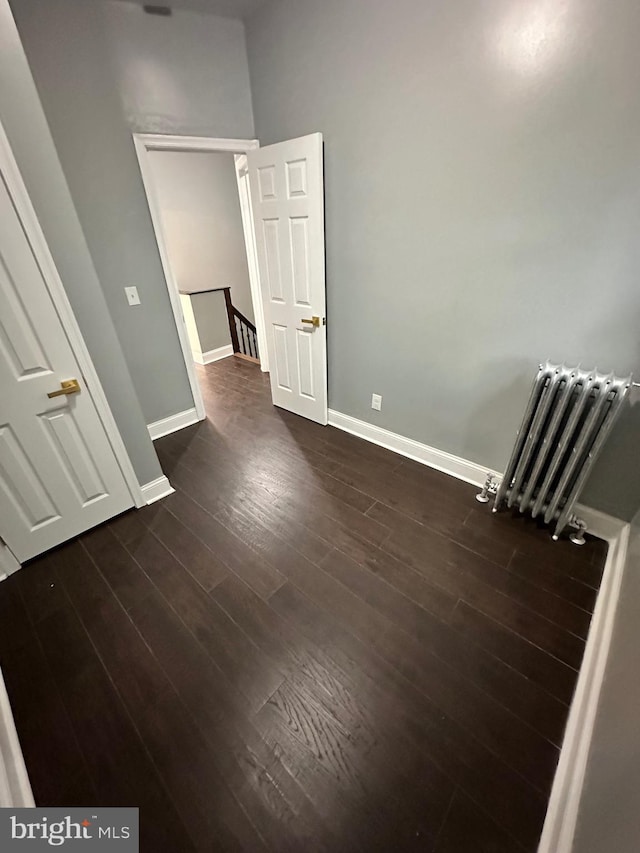2937 N Judson St, Philadelphia, PA 19132 - spare room featuring dark wood finished floors and radiator heating unit