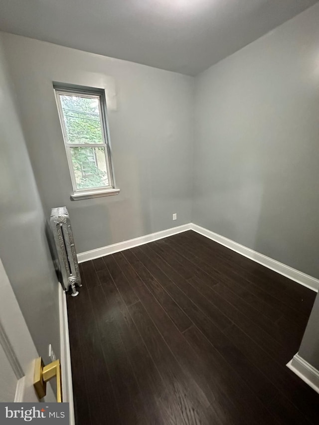 2937 N Judson St, Philadelphia, PA 19132 - unfurnished room featuring radiator heating unit and dark wood-style flooring