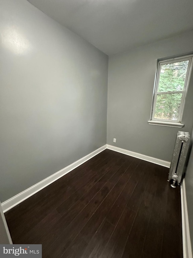 2937 N Judson St, Philadelphia, PA 19132 - empty room featuring radiator and dark wood-style flooring
