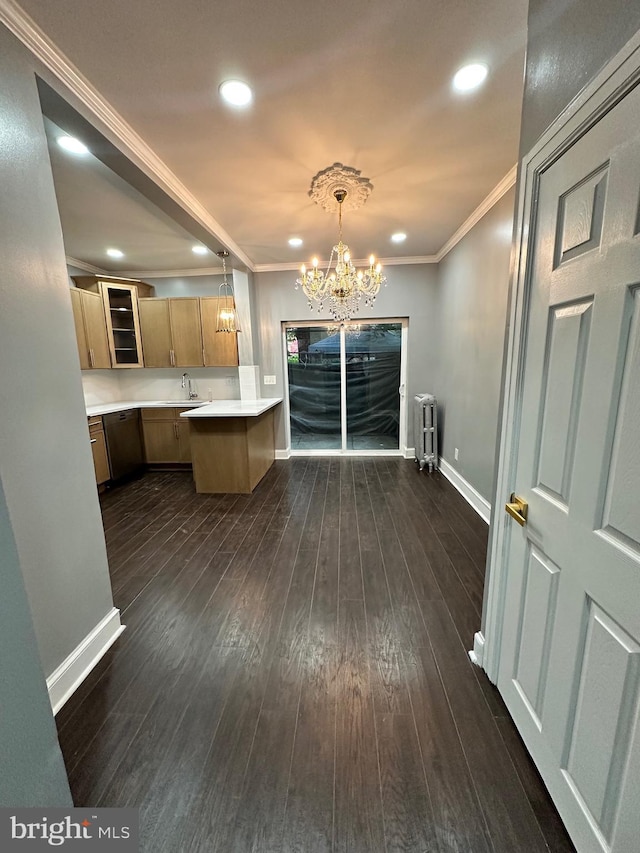 2937 N Judson St, Philadelphia, PA 19132 - kitchen featuring radiator, light countertops, a peninsula, ornamental molding, and dark wood-style floors
