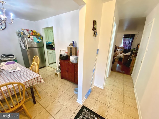1064 W W Side Dr Unit 25-F, Gaithersburg, MD 20878 - dining space featuring light tile patterned floors and a chandelier