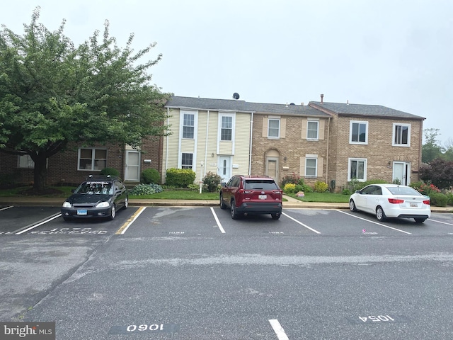 1064 W W Side Dr Unit 25-F, Gaithersburg, MD 20878 - view of building exterior featuring uncovered parking