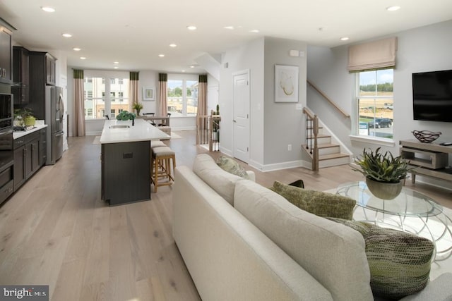 3453 Saint Robin Ln, Bowie, MD 20716 - living area with light wood-style flooring, recessed lighting, and stairway