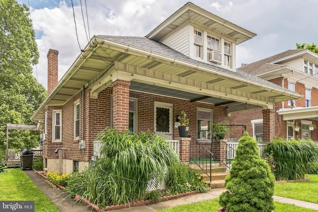 1714 S Main St, Bechtelsville, PA 19505 - bungalow-style home with a porch, brick siding, a shingled roof, and a chimney