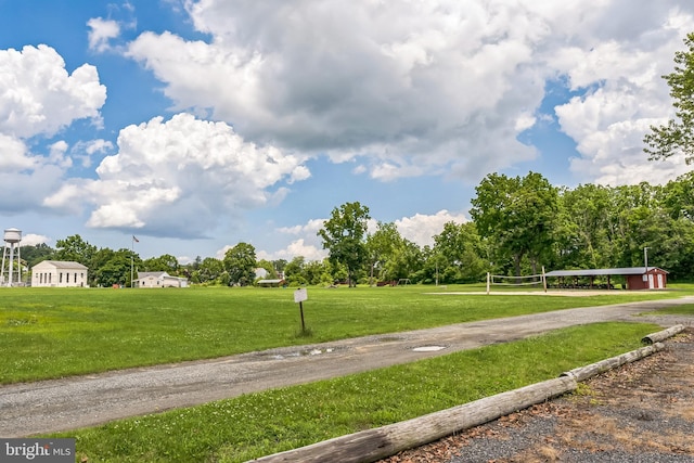 1714 S Main St, Bechtelsville, PA 19505 - surrounding community featuring a lawn, driveway, and view of wooded area