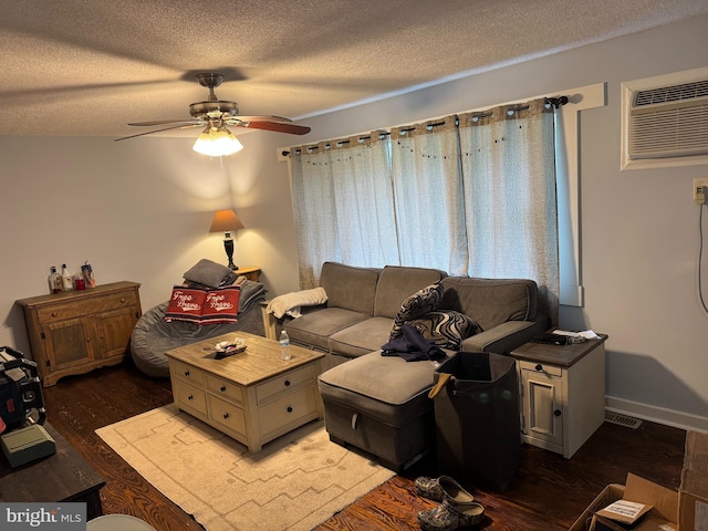42 Reed St, Mohnton, PA 19540 - living area featuring ceiling fan, a textured ceiling, a wall mounted AC, and wood finished floors