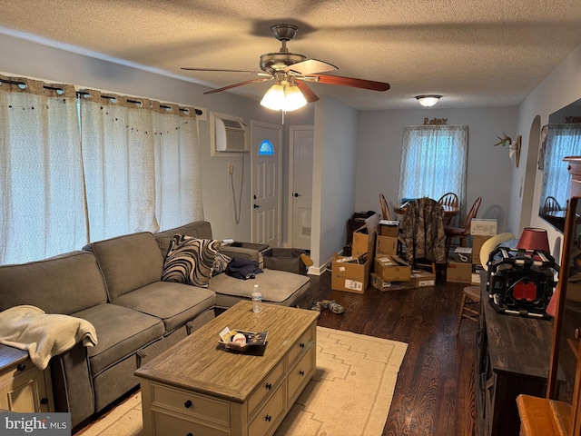 42 Reed St, Mohnton, PA 19540 - living area featuring a ceiling fan, light wood-style flooring, a wall mounted AC, and a textured ceiling
